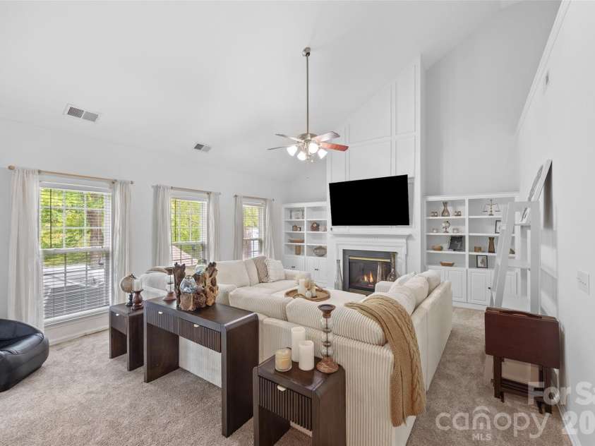 14569 Greenpoint Lane, Huntersville, NC 28078.  MLS# CAR4327431, YatesRealty ID 17560. Gas fireplace, built-ins and vaulted ceilings in living room