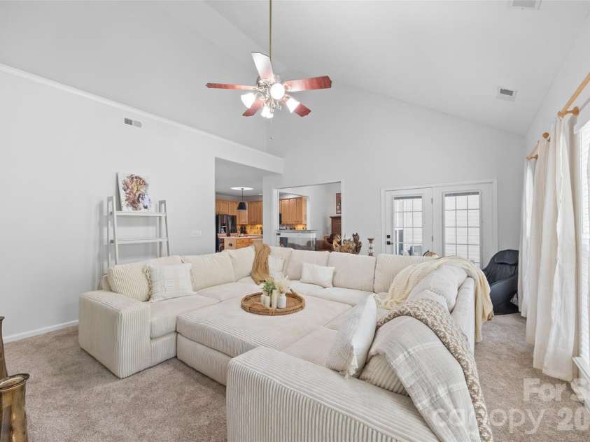 14569 Greenpoint Lane, Huntersville, NC 28078.  MLS# CAR4327431, YatesRealty ID 17560. Spacious living room with screened porch access