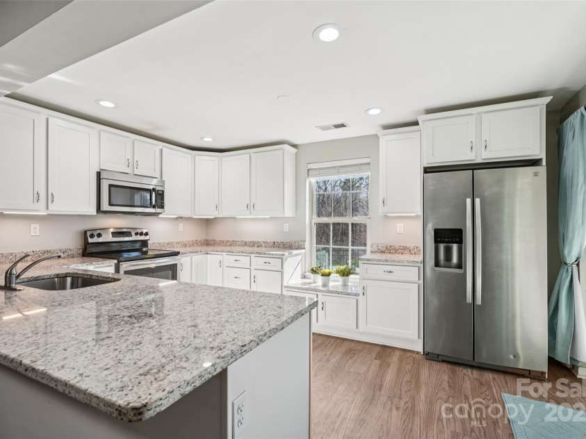 2271 Stone Pile Drive, Concord, NC 28025.  MLS# CAR4330915, YatesRealty ID 17561. Basement kitchen