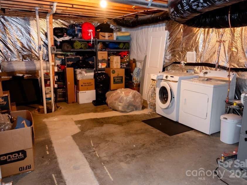 2271 Stone Pile Drive, Concord, NC 28025.  MLS# CAR4330915, YatesRealty ID 17561. Basement storage room & laundry