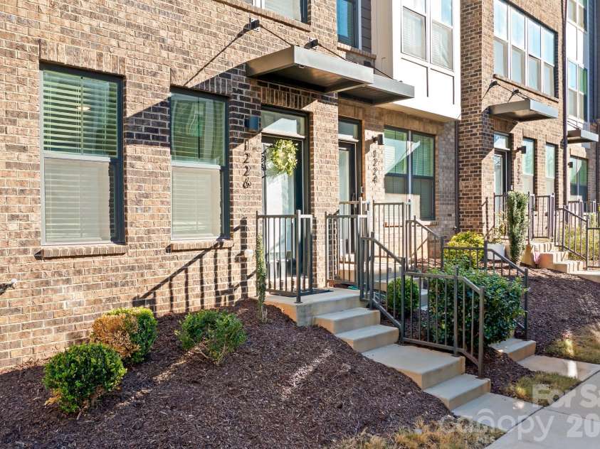 1226 Gleason Way, Charlotte, NC 28217.  MLS# CAR4336761, YatesRealty ID 17562. Step into a quiet, end-unit home where privacy meets prime LoSo living