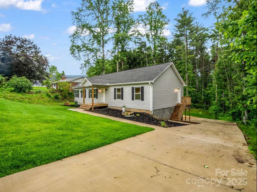 247-1 Bent Creek Ranch Road, Asheville, NC 28806.  MLS# CAR4266122, YatesRealty ID 17565. Driveway extend to flat backyard and basement entrance