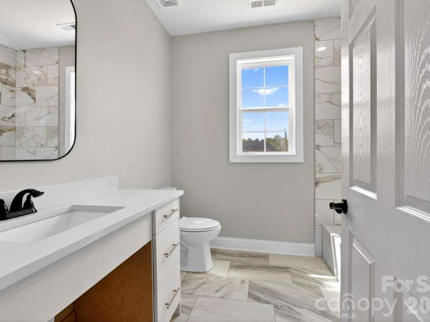 416 Whitmore Street, Lenoir, NC 28645.  MLS# CAR4363321, YatesRealty ID 17569. Hall bathroom