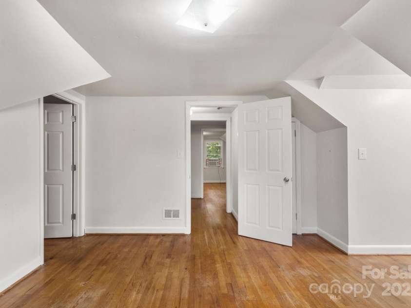 728 Blanton Street, Shelby, NC 28150.  MLS# CAR4274982, YatesRealty ID 1757. This is one of the upstairs bedrooms. The door to the left leads to a huge storage room.