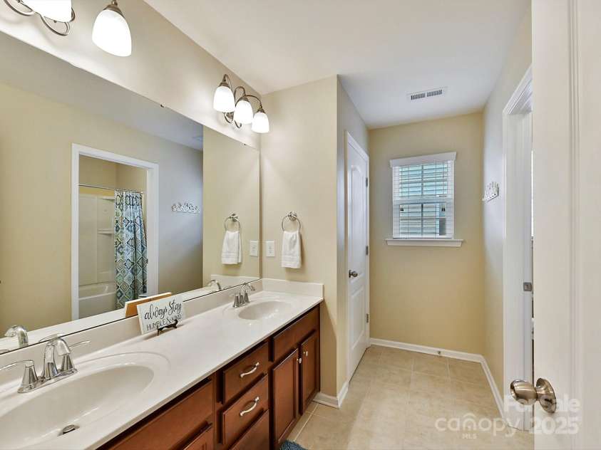 3020 Sewee Lane, Waxhaw, NC 28173.  MLS# CAR4210967, YatesRealty ID 17573. Hall bath for both 2nd & 3rd BRs, dual sinks, private commode