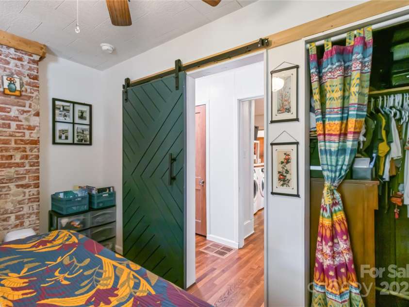 65 Craig Circle, Asheville, NC 28805.  MLS# CAR4259454, YatesRealty ID 17575. Primary bedroom view into the hallway/Laundry room area