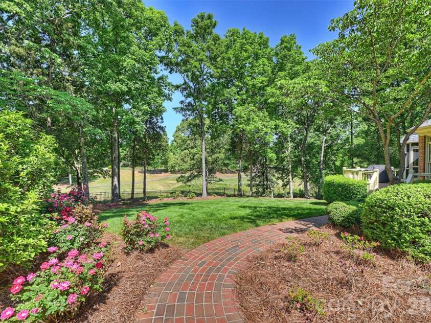 4227 Shepherdleas Lane, Charlotte, NC 28277.  MLS# CAR4358480, YatesRealty ID 17586. Lovely brick path with mature roses