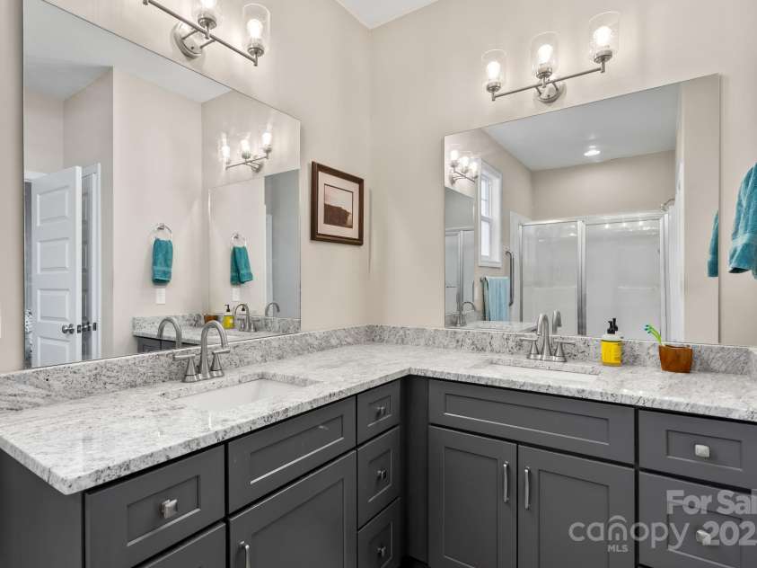 79 Greenwood Fields Drive, Asheville, NC 28804.  MLS# CAR4220069, YatesRealty ID 17589. Double vanity in primary bath