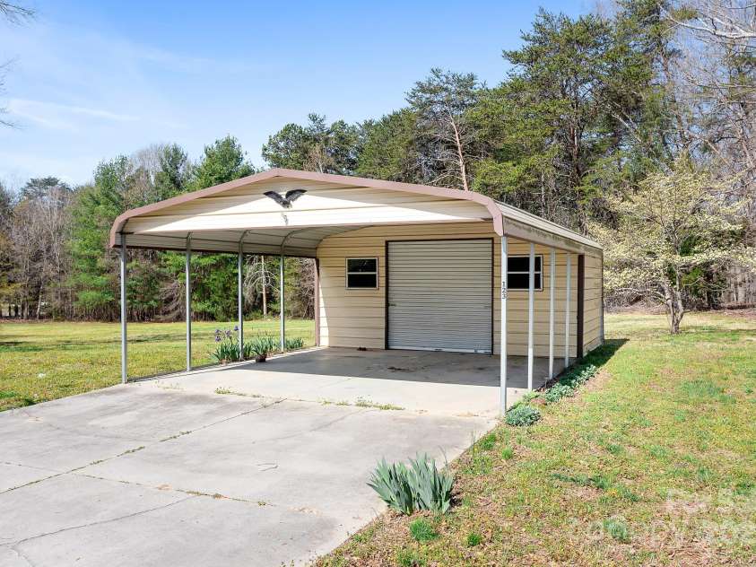 1235 Wilma Sigmon Road, Lincolnton, NC 28092.  MLS# CAR4238963, YatesRealty ID 17591. The detached carport provides storage.