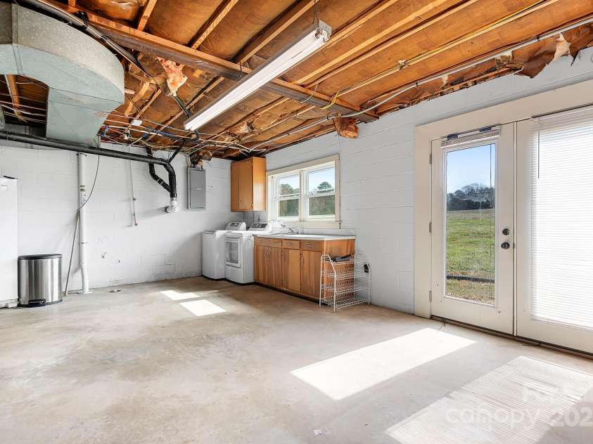 1235 Wilma Sigmon Road, Lincolnton, NC 28092.  MLS# CAR4238963, YatesRealty ID 17591. The unfinished walkout basement is large and could provide additional living space if finished (there is a fireplace)