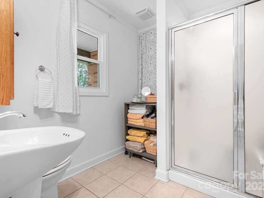 1235 Wilma Sigmon Road, Lincolnton, NC 28092.  MLS# CAR4238963, YatesRealty ID 17591. There is a full sized bathroom on the first floor that also has space for a stackable washer and dryer.