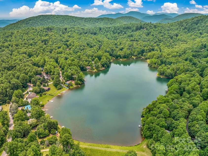 1501 Tanglewood Lane, Saluda, NC 28773.  MLS# CAR4266264, YatesRealty ID 17595. Lake Sheila in the spring