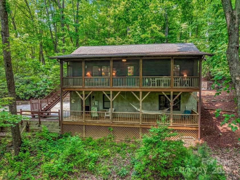 1501 Tanglewood Lane, Saluda, NC 28773.  MLS# CAR4266264, YatesRealty ID 17595. Tucked in the trees for privacy