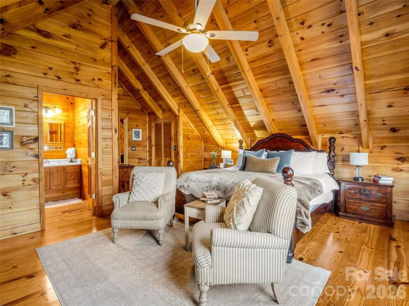 446 Rainbow Circle, Lake Lure, NC 28746.  MLS# CAR4329163, YatesRealty ID 17596. Another view of upper level bedroom suite with electric fireplace