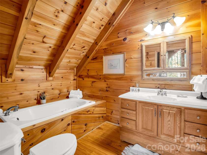 446 Rainbow Circle, Lake Lure, NC 28746.  MLS# CAR4329163, YatesRealty ID 17596. Bath off of upper level suite
