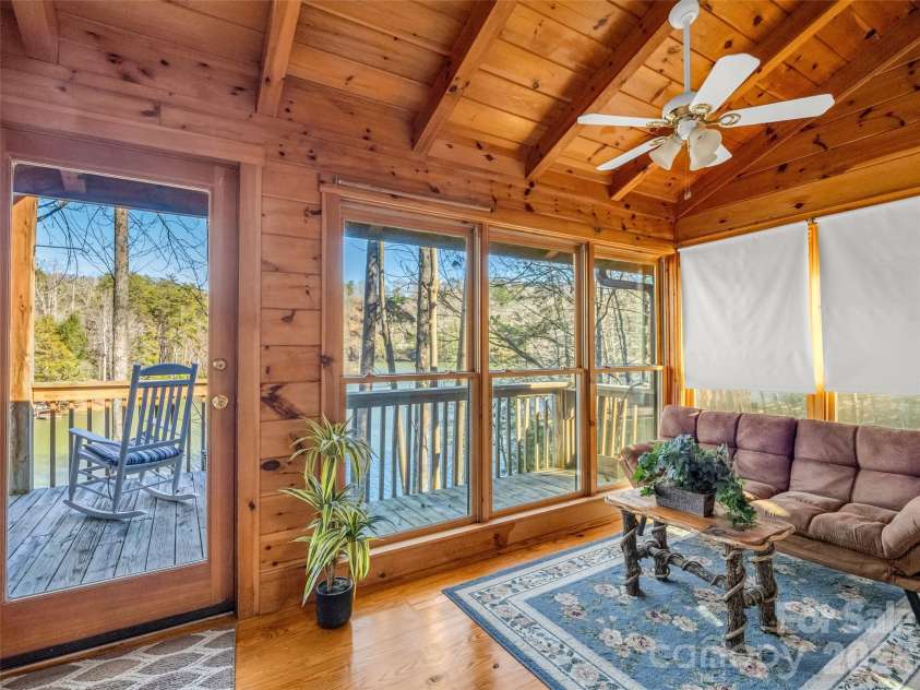 446 Rainbow Circle, Lake Lure, NC 28746.  MLS# CAR4329163, YatesRealty ID 17596. Setting room off of the lower level primary suite
