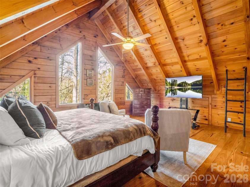 446 Rainbow Circle, Lake Lure, NC 28746.  MLS# CAR4329163, YatesRealty ID 17596. Upper level primary bedroom suite