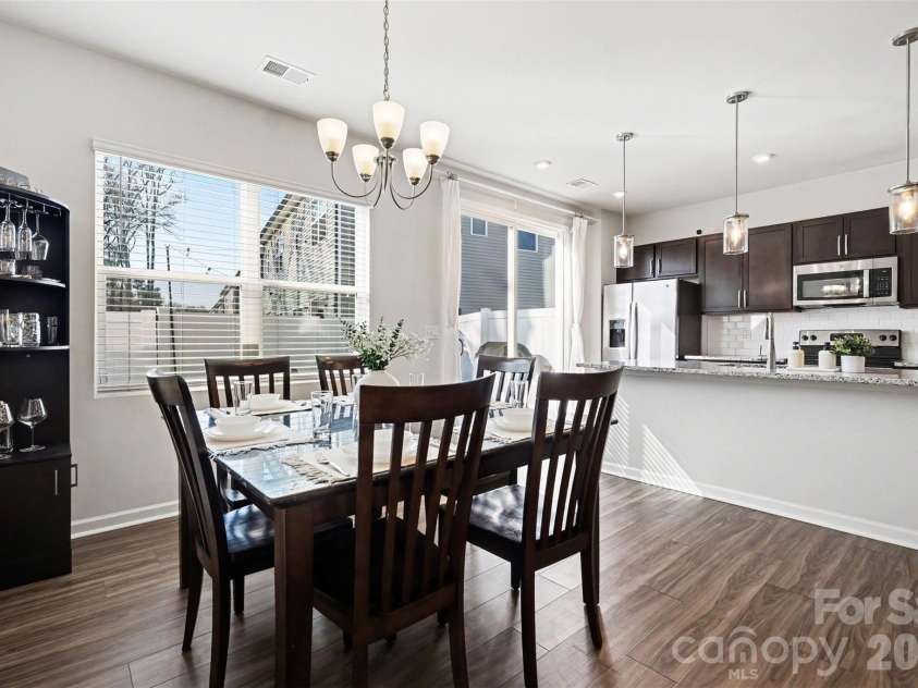 9106 Widden Way, Charlotte, NC 28269.  MLS# CAR4353972, YatesRealty ID 17601. Dining area into kitchen