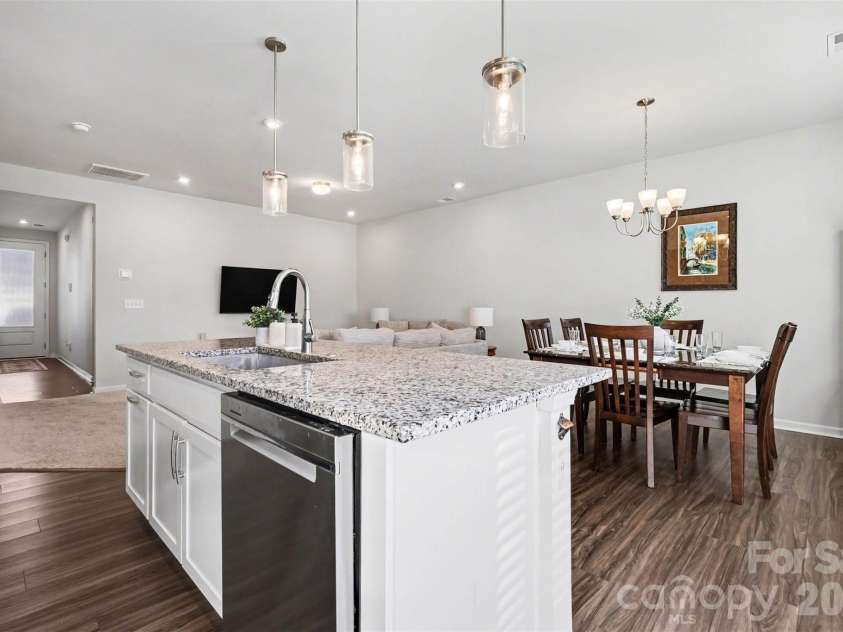 9106 Widden Way, Charlotte, NC 28269.  MLS# CAR4353972, YatesRealty ID 17601. Kitchen into dining & living
