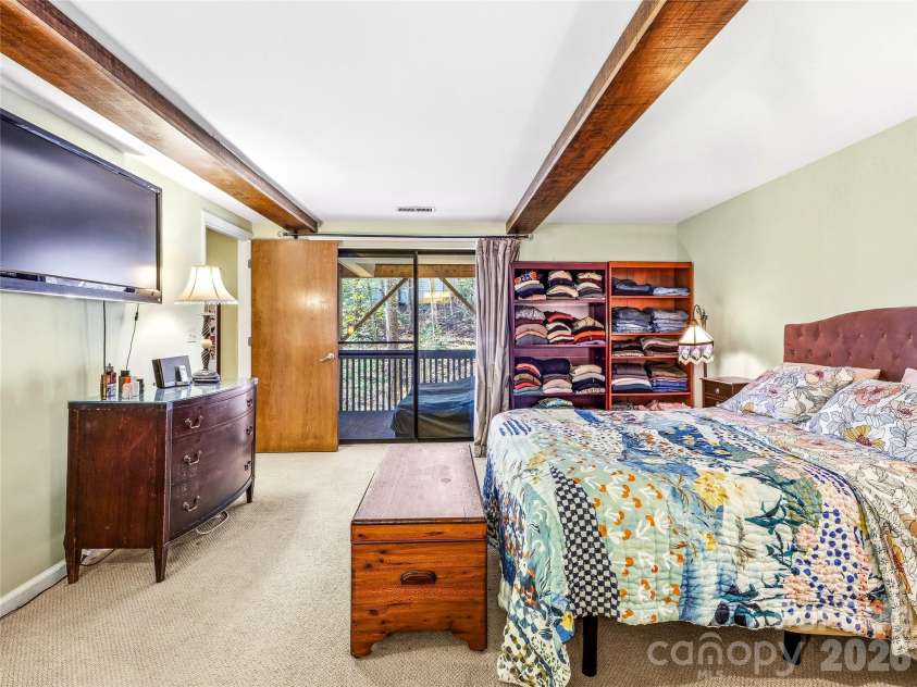 14 Cedarwood Drive, Asheville, NC 28803.  MLS# CAR4357475, YatesRealty ID 17604. Lower Level Bedroom with deck access
