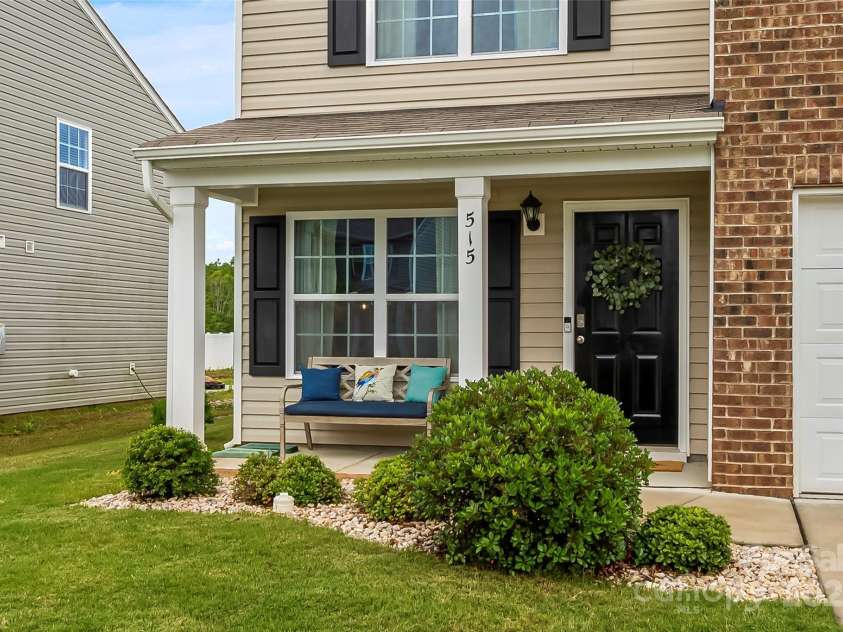 515 Benford Lane, Stanley, NC 28164.  MLS# CAR4265169, YatesRealty ID 17613. The welcoming front porch greets family and friends alike.