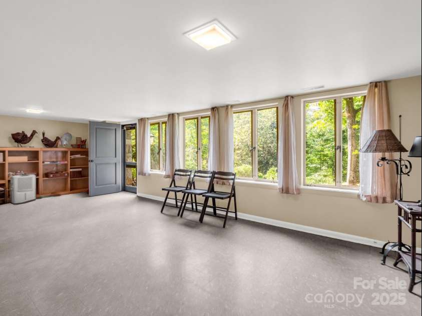 11 Hearthstone Lane, Landrum, SC 29356.  MLS# CAR4267724, YatesRealty ID 17615. Basement Level family room