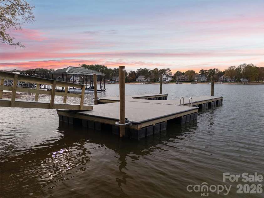 240 Shoreline Loop, Mooresville, NC 28117.  MLS# CAR4375040, YatesRealty ID 17619. Brand new private dock positioned for easy access and protected water ideal for boats jet skis and lake activities