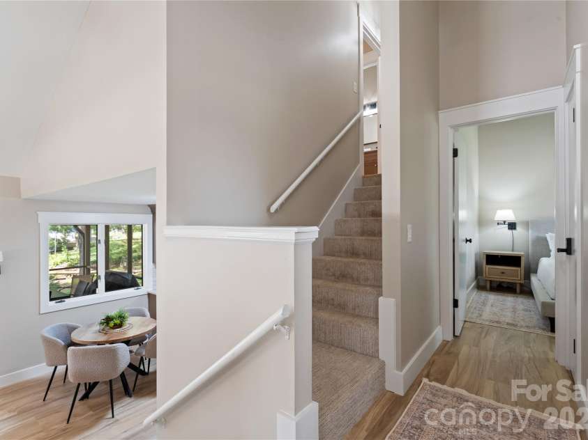 240 Shoreline Loop, Mooresville, NC 28117.  MLS# CAR4375040, YatesRealty ID 17619. Open concept floor plan with elevated interior layout showcasing vaulted ceilings and spacious design