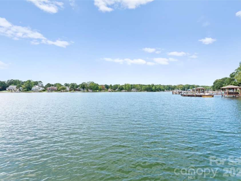 240 Shoreline Loop, Mooresville, NC 28117.  MLS# CAR4375040, YatesRealty ID 17619. Wide open water views capturing the beauty of Lake Norman and offering a peaceful setting for boating and relaxation