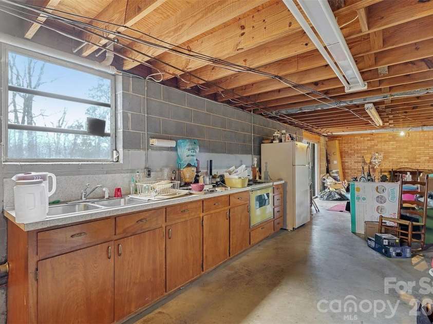 2401 Penninger Road, Concord, NC 28025.  MLS# CAR4344658, YatesRealty ID 1762. Basement features a kitchenette