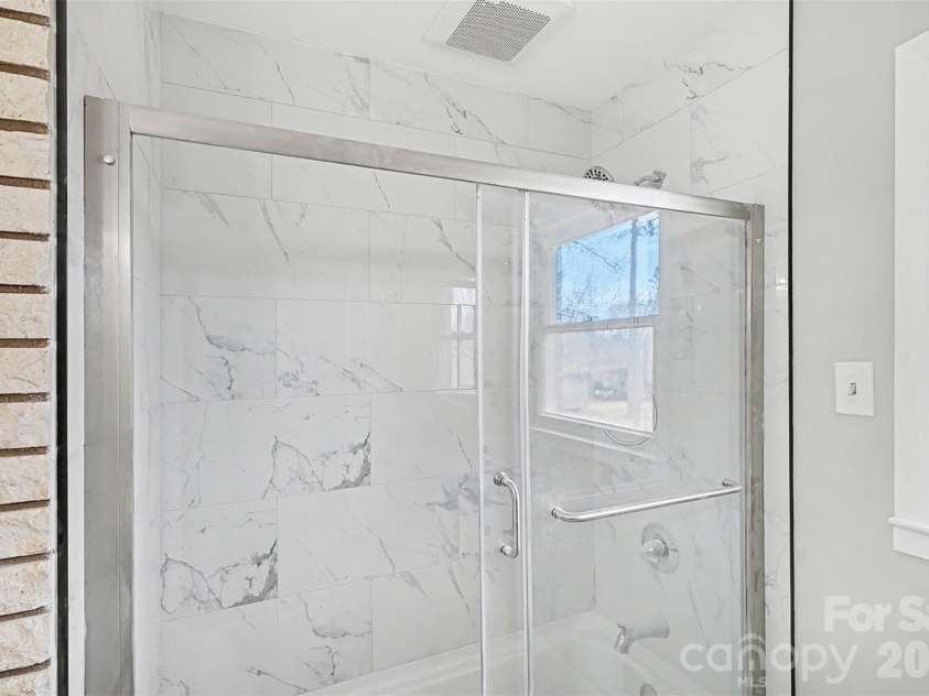 2401 Penninger Road, Concord, NC 28025.  MLS# CAR4344658, YatesRealty ID 1762. Completely renovated hall bath