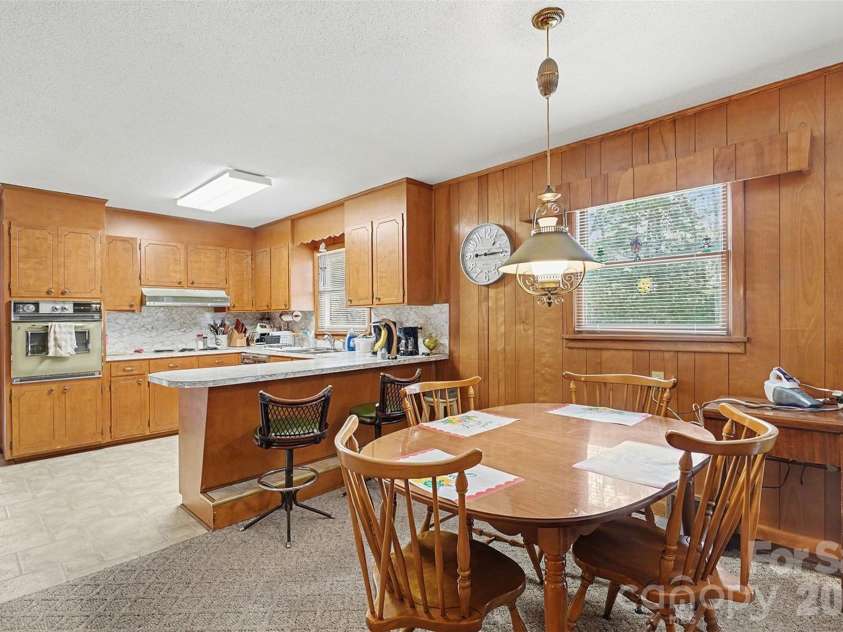 2401 Penninger Road, Concord, NC 28025.  MLS# CAR4344658, YatesRealty ID 1762. Dining area and bar