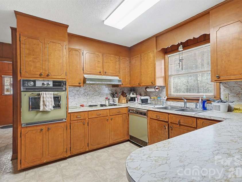 2401 Penninger Road, Concord, NC 28025.  MLS# CAR4344658, YatesRealty ID 1762. Functional kitchen with plenty of room for 2!