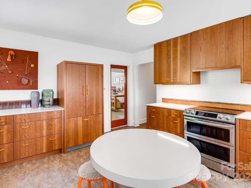 80 Sunset Drive, Marshall, NC 28753.  MLS# CAR4246500, YatesRealty ID 17627. Sleek, functional cabinetry with vintage bake-lite pulls