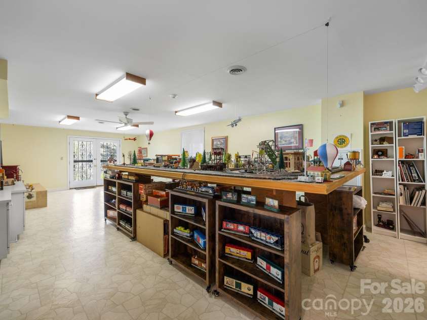 140 Meadowlark Drive, Tryon, NC 28782.  MLS# CAR4364731, YatesRealty ID 17628. Basement level den