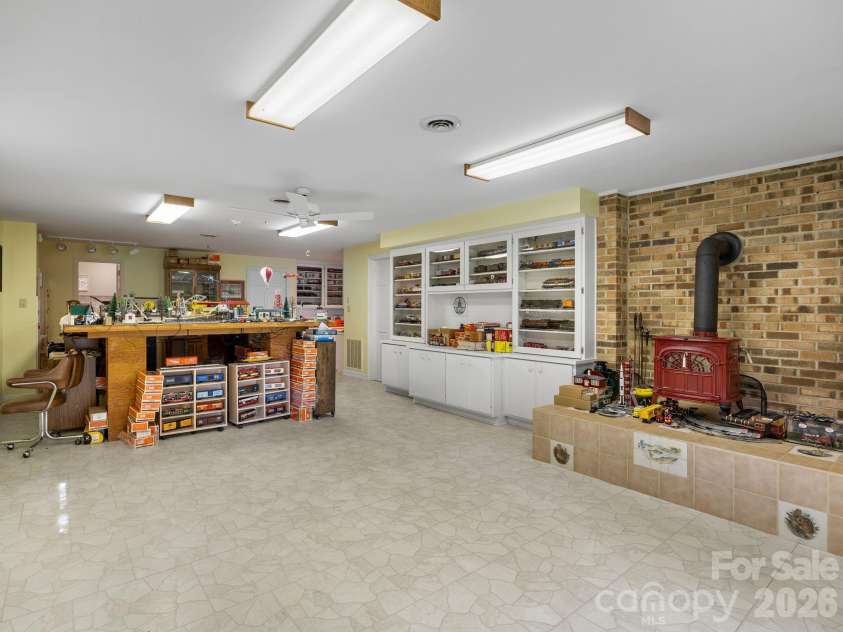 140 Meadowlark Drive, Tryon, NC 28782.  MLS# CAR4364731, YatesRealty ID 17628. Basement level den