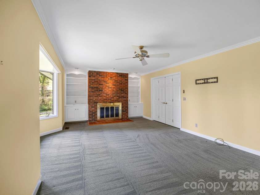 140 Meadowlark Drive, Tryon, NC 28782.  MLS# CAR4364731, YatesRealty ID 17628. Den connects to great room and kitchen