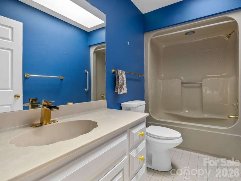 140 Meadowlark Drive, Tryon, NC 28782.  MLS# CAR4364731, YatesRealty ID 17628. Guest bathroom on main