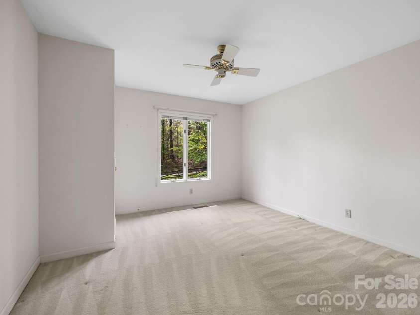 140 Meadowlark Drive, Tryon, NC 28782.  MLS# CAR4364731, YatesRealty ID 17628. Guest bedroom on main