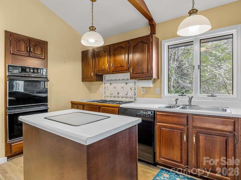 140 Meadowlark Drive, Tryon, NC 28782.  MLS# CAR4364731, YatesRealty ID 17628. Kitchen has double wall oven.