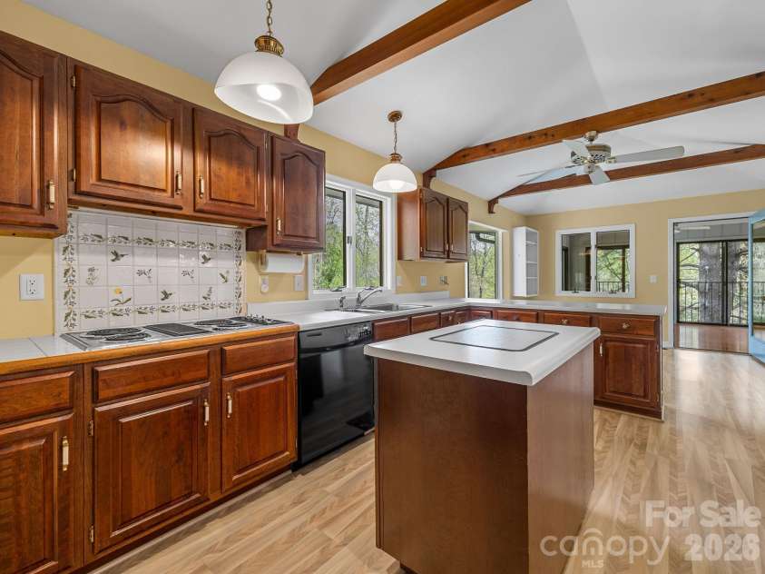140 Meadowlark Drive, Tryon, NC 28782.  MLS# CAR4364731, YatesRealty ID 17628. Kitchen with Jenn-Air Range and Island