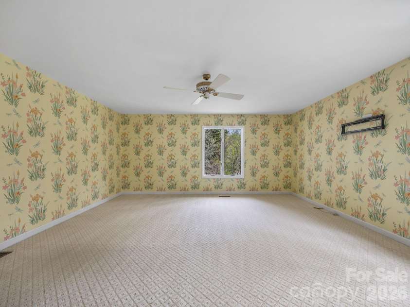140 Meadowlark Drive, Tryon, NC 28782.  MLS# CAR4364731, YatesRealty ID 17628. Primary bedroom