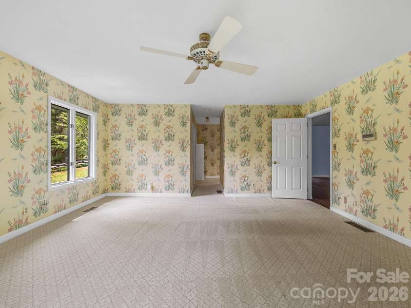140 Meadowlark Drive, Tryon, NC 28782.  MLS# CAR4364731, YatesRealty ID 17628. Spacious Primary Bedroom 