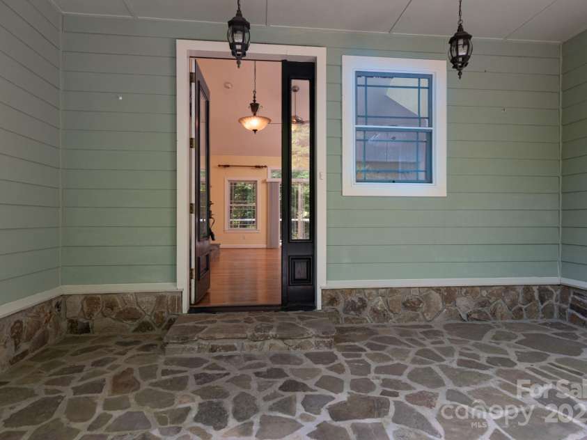 124 Meadow View Road, Roaring Gap, NC 28668.  MLS# CAR4267480, YatesRealty ID 17634. Inviting entrance with stone porch