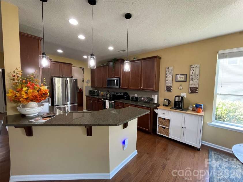 308 Tall Wheat Lane, Mount Holly, NC 28120.  MLS# CAR4306056, YatesRealty ID 17634. Kitchen high top bar seating