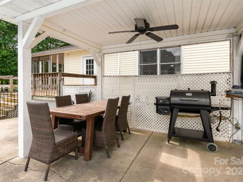 131 Scotland Drive, Mooresville, NC 28115.  MLS# CAR4254939, YatesRealty ID 17636. Covered Porch by the Pool