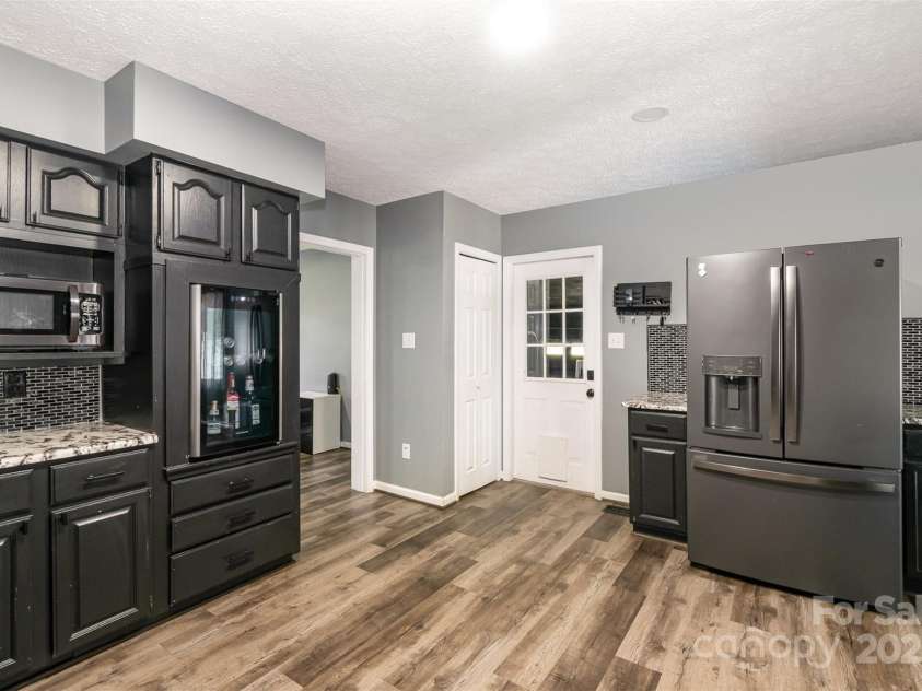 131 Scotland Drive, Mooresville, NC 28115.  MLS# CAR4254939, YatesRealty ID 17636. Tons of storage, counter space & wine cooler