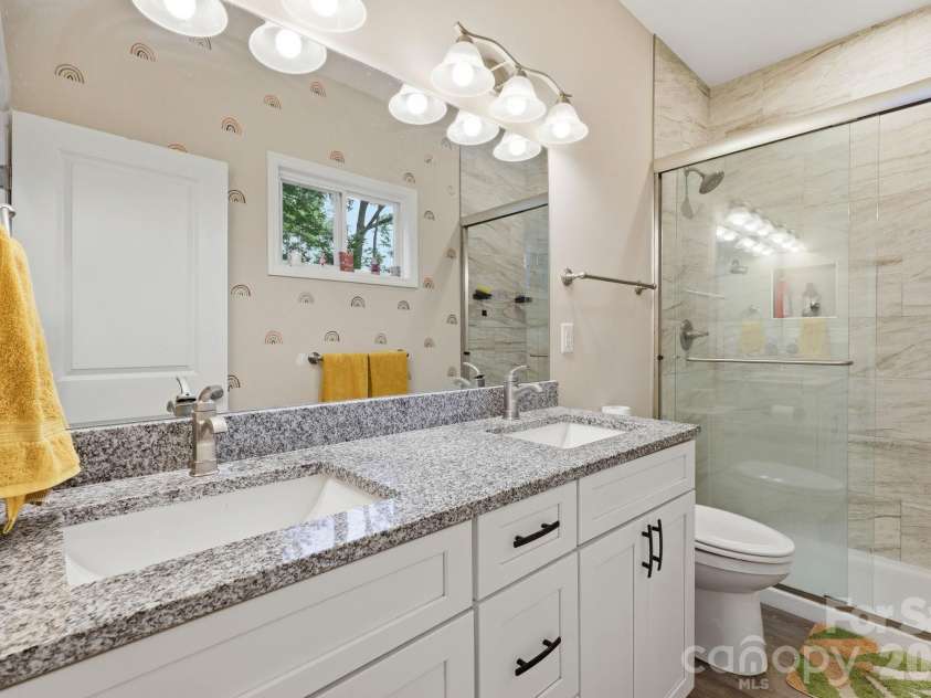 239 Northside Street, Canton, NC 28716.  MLS# CAR4349371, YatesRealty ID 17639. Spacious primary bathroom with walk-in shower