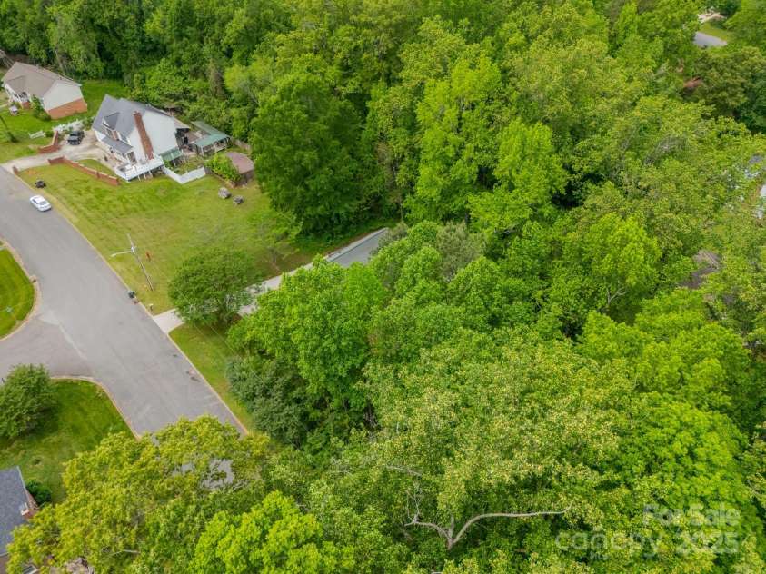 2646 Jacobs Road, Gastonia, NC 28054.  MLS# CAR4245565, YatesRealty ID 17641. 2646 & 2700 Jacobs Road. Wooded lot making the property .76 acres total.