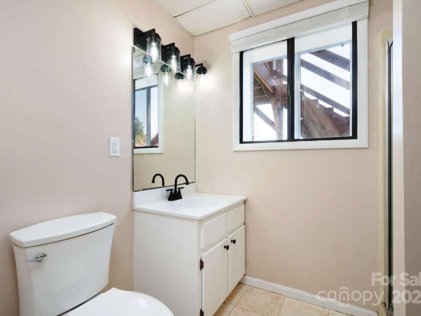 58 Braddock Way, Asheville, NC 28803.  MLS# CAR4246877, YatesRealty ID 17643. Basement Bathroom